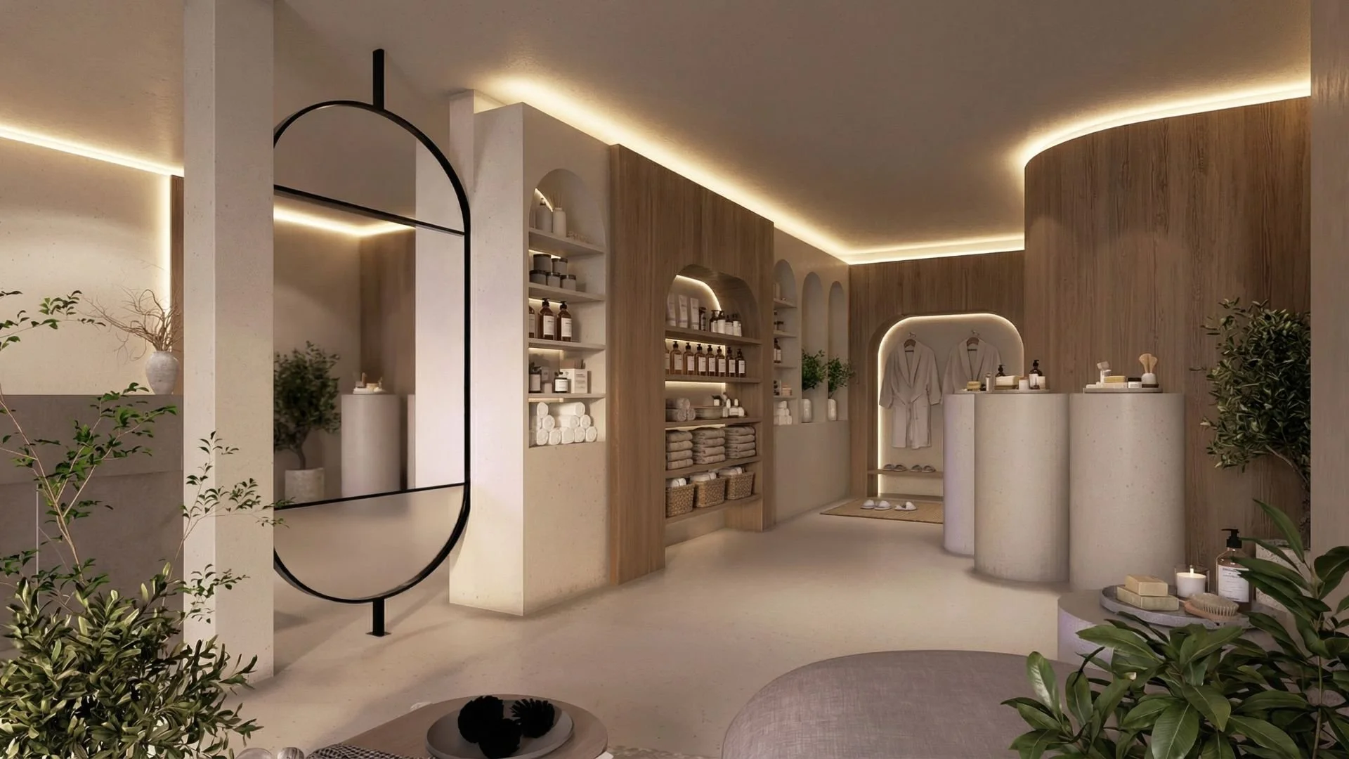 Interior of a spa or wellness center with neutral tones, wooden accents, and various shelves holding towels, bottles, and skincare products. There are plants and robes hanging on the wall, with soft ambient lighting.