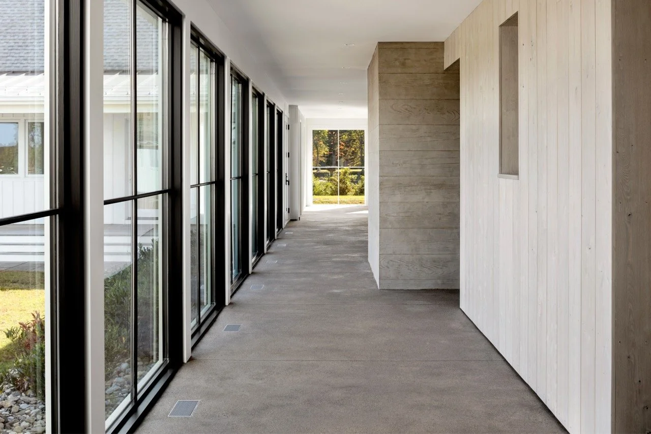 Concrete-Hallway-Expansive-Windows-Waterfront-Farmhouse-Kimmel Studio Large.jpeg