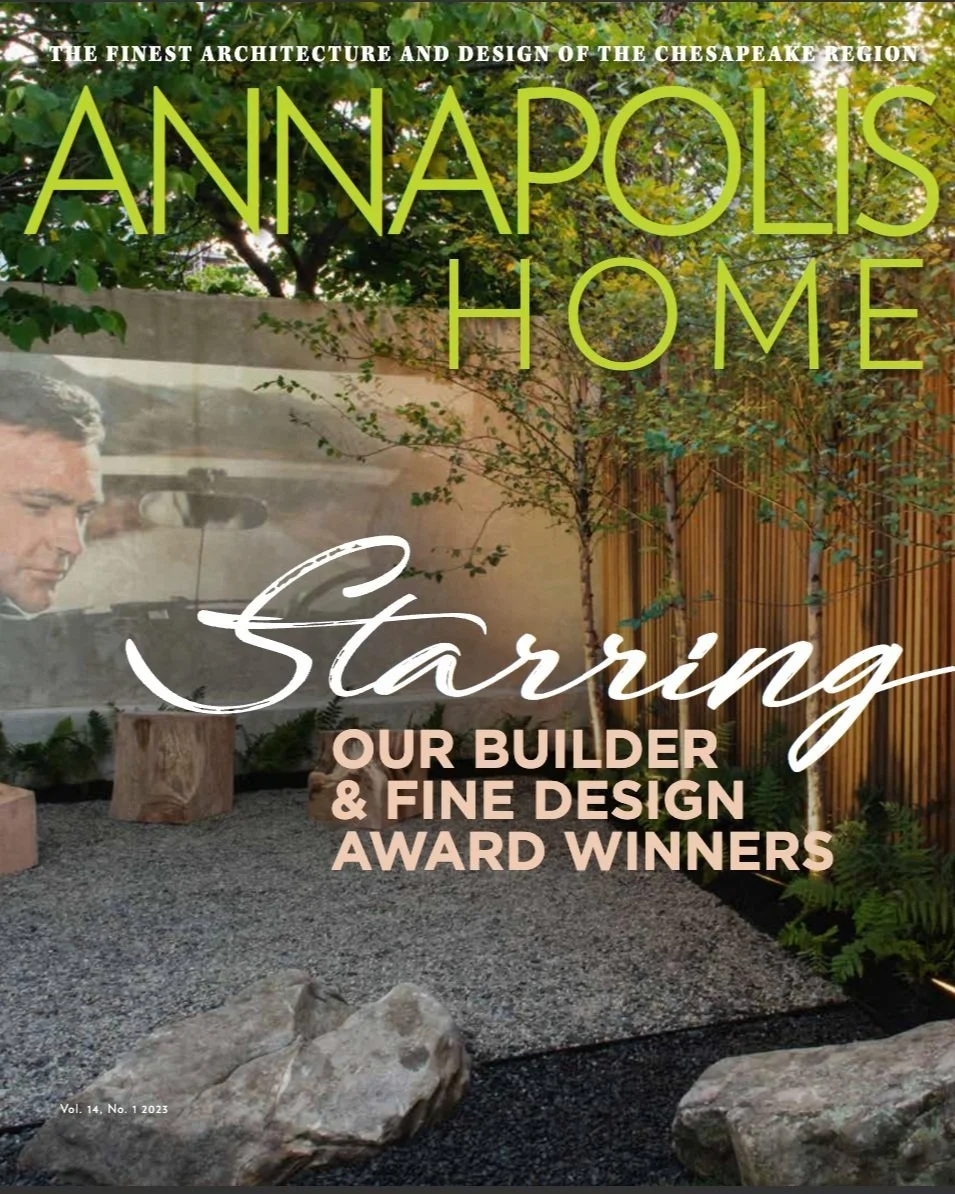 Kimmel Studio Architects Annapolis Home magazine featuring a landscaped outdoor space with rocks, gravel, trees, and a wooden fence, with overlaid text mentioning the top architecture and design of the Chesapeake region.