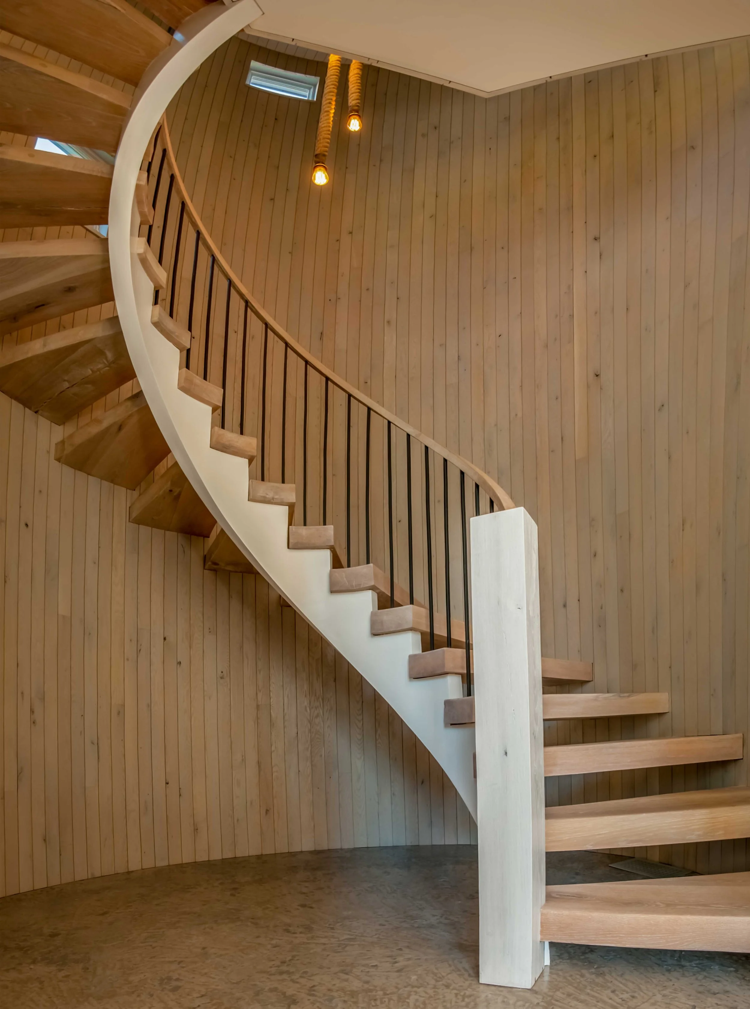 modern-barn-house-spiral-staircase-rope-lights-queenstown-md-kimmel-architects.jpg