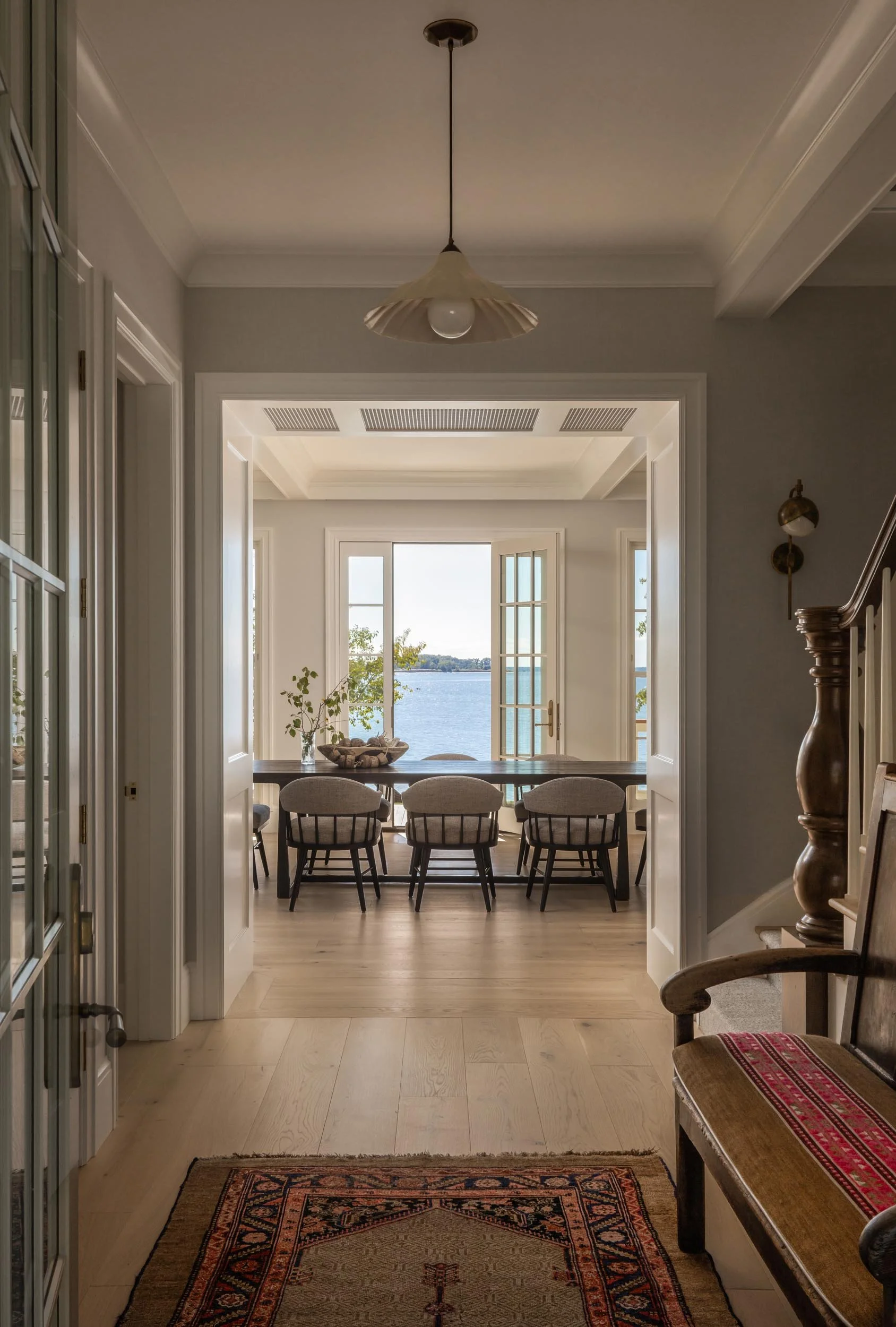 interior-hallway-dining-room-water-view-transitional-design-kimmel-studio-architects.jpg