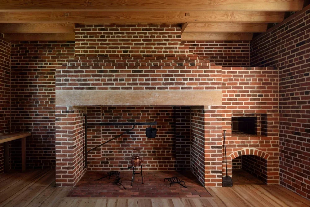 historic-preservation-process-cloverfields-brick-fireplace-kimmel-architects.webp