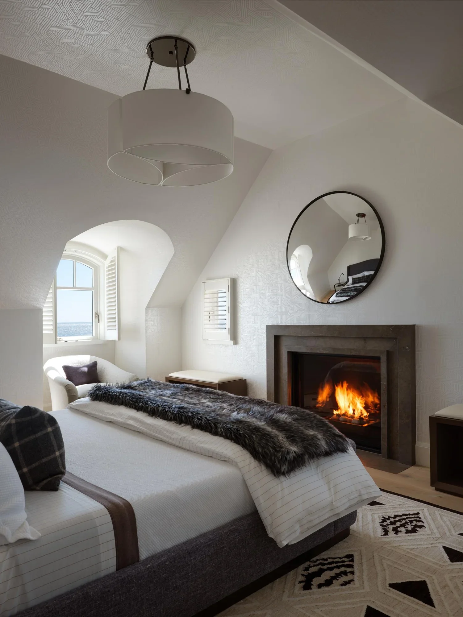 shingle-beach-house-coastal-guest-bedroom-fireplace-rehoboth-de-kimmel-architects.webp