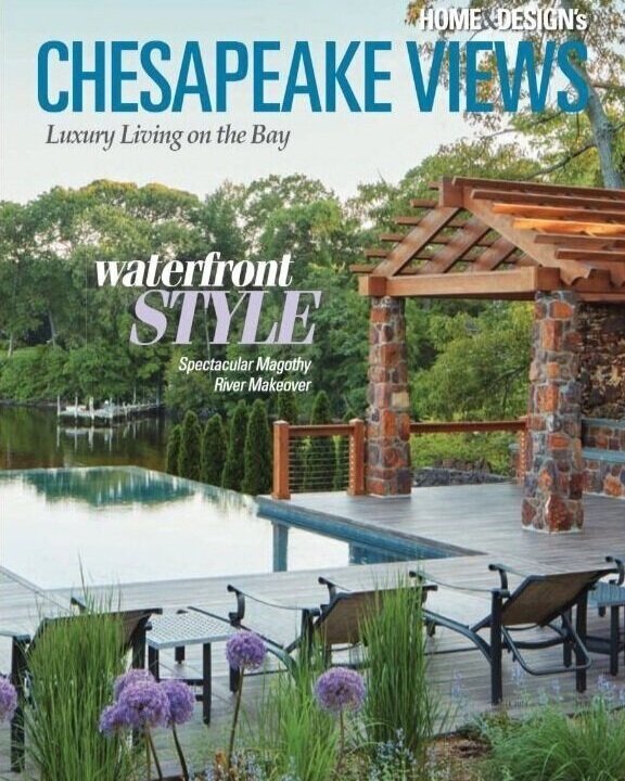 Kimmel Studio Architects Chesapeake Views magazine, featuring a waterfront view with a deck, seating area, and a landscaped yard with trees and flowers.