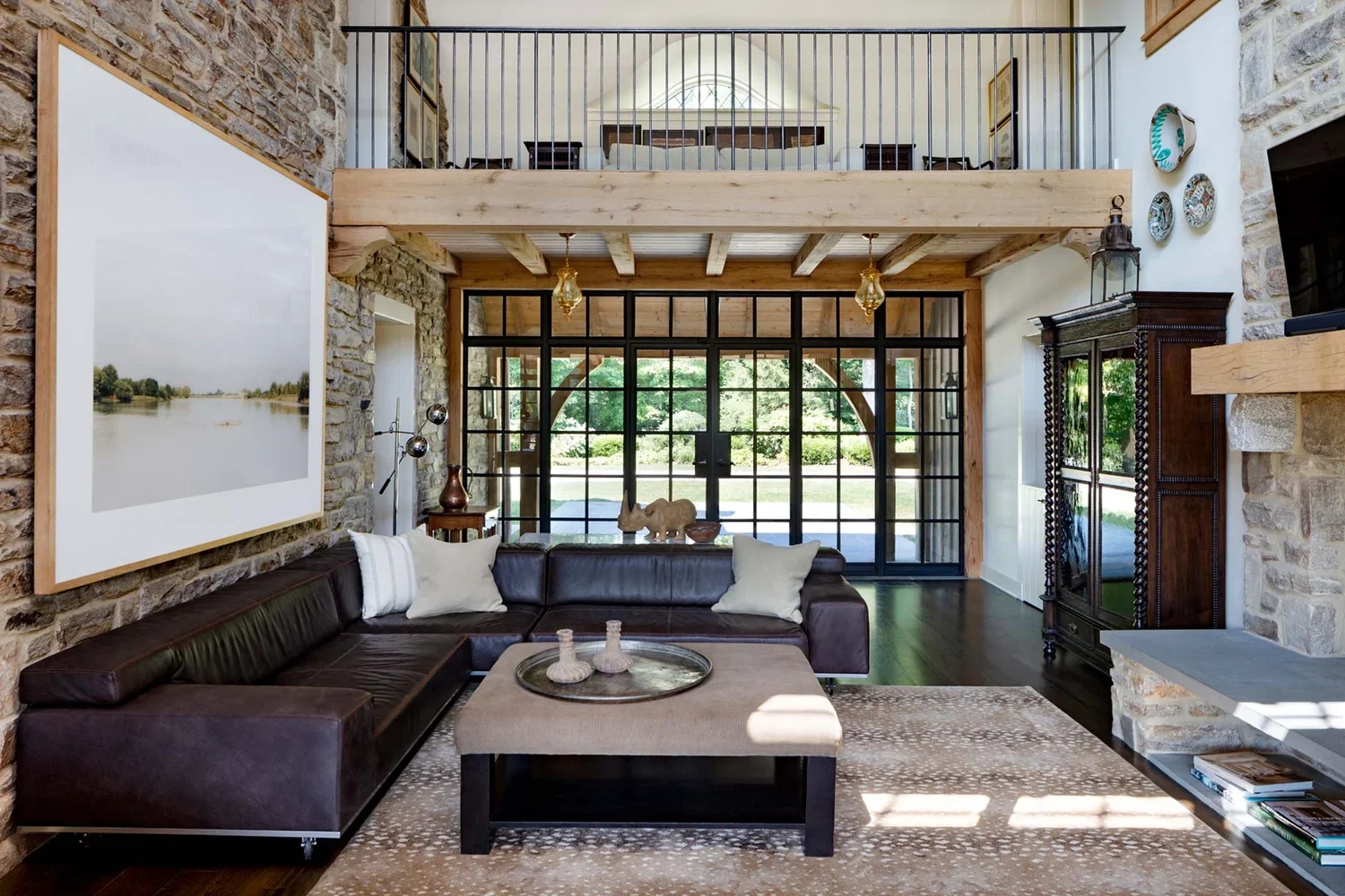 tudor-renovation-stone-living-room-interior-design-pikesville-md-kimmel-architects.webp