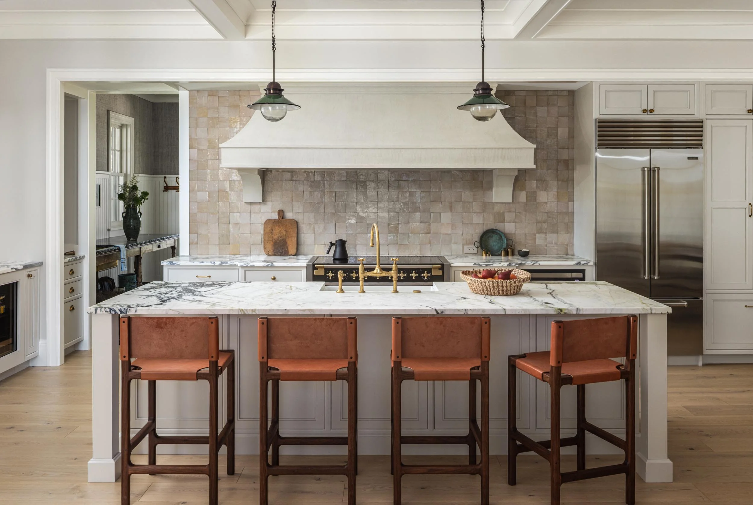 luxury-kitchen-with-marble-island-and-brass-fixtures-kimmel-studio-architects.jpg