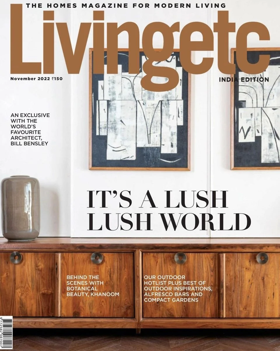 Kimmel Studio Architects Livingetc magazine, featuring an interior scene with framed abstract artwork on a white wall, a large beige ceramic vase on a wooden sideboard, modern living and outdoor gardening.