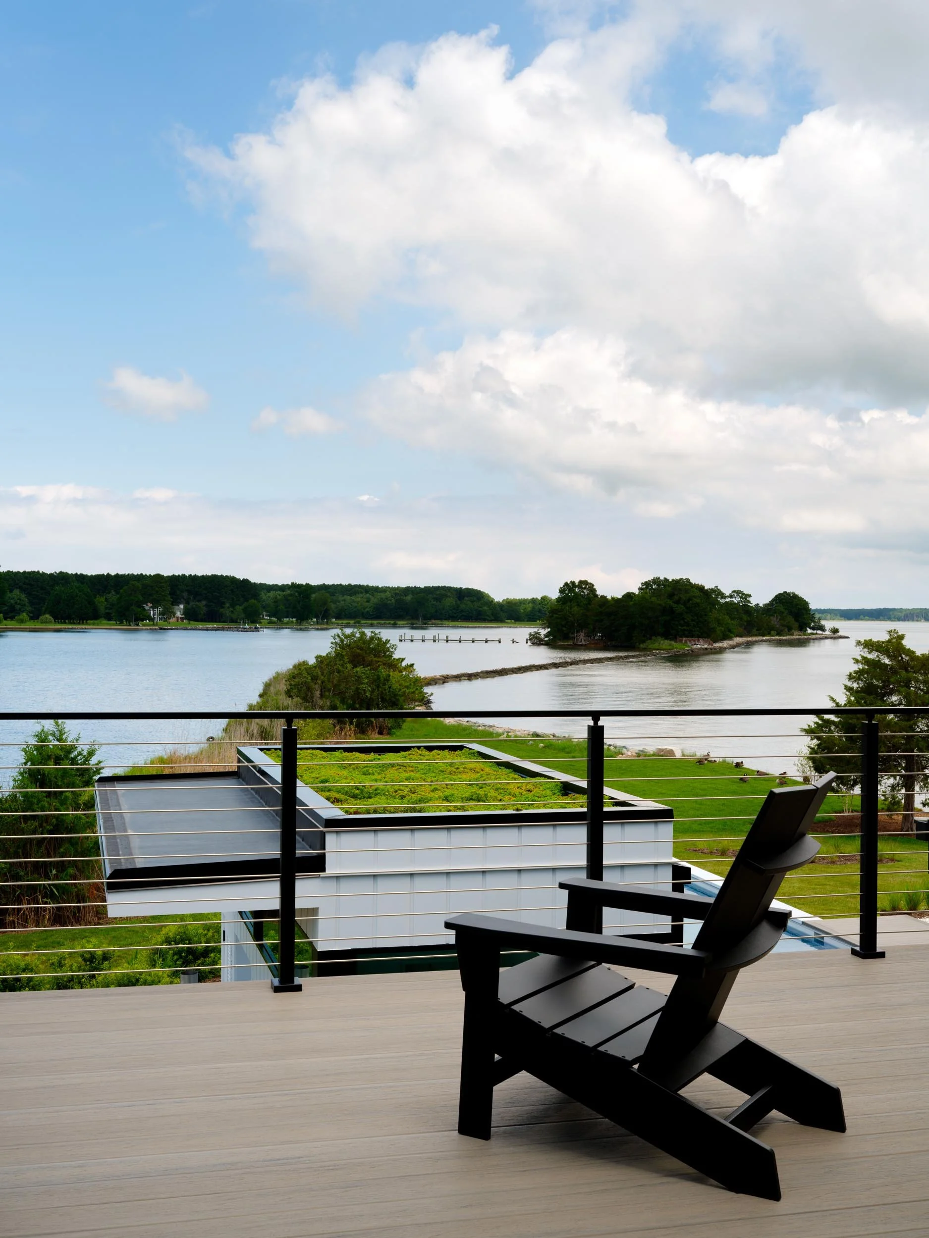 waterfront-minimalist-home-balcony-adirondack-chair-view-maryland-kimmel-architects.jpg