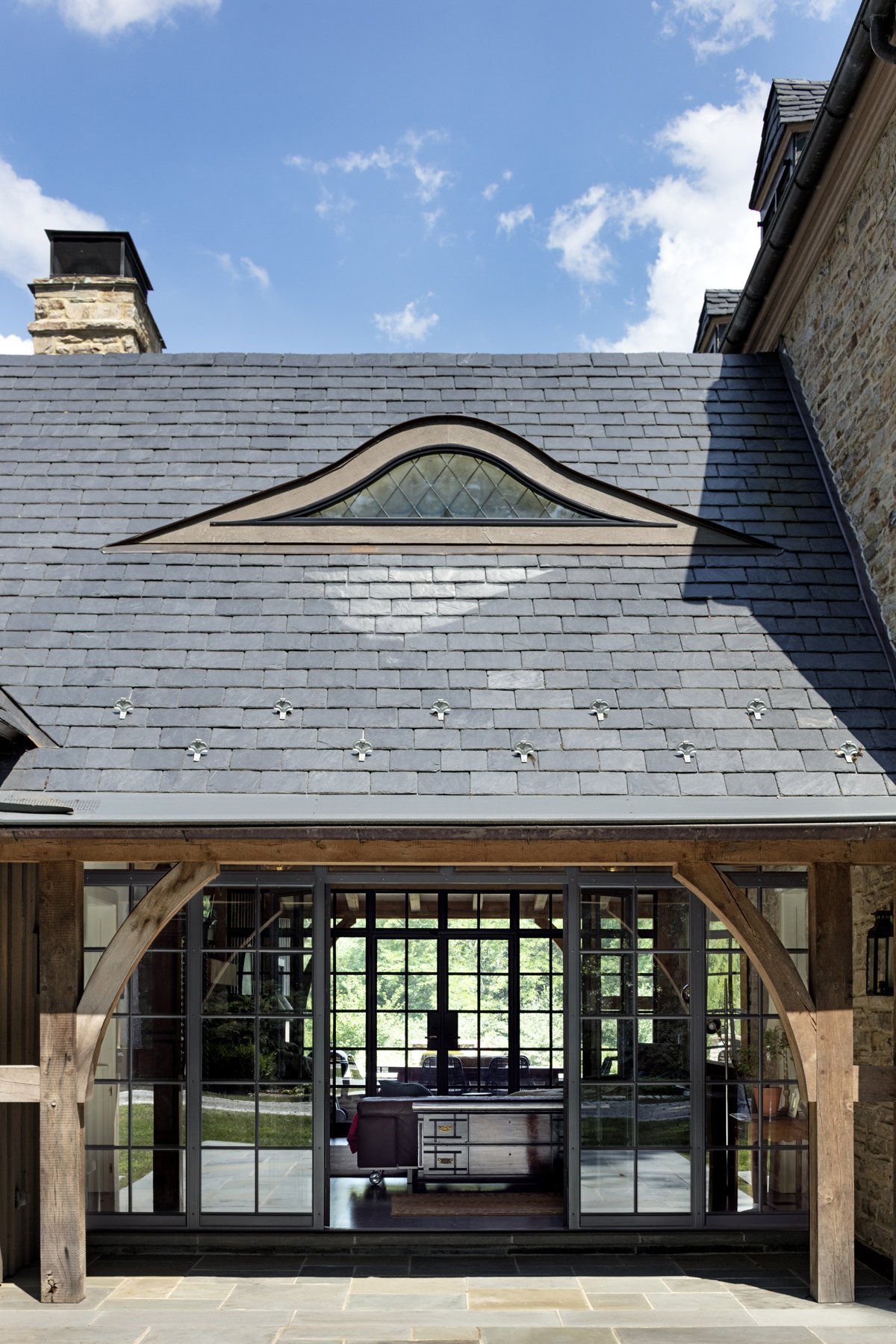 tudor-renovation-stone-eyebrow-dormer-roof-pikesville-md-kimmel-architects.jpg