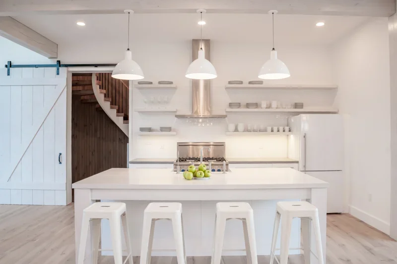 modern-barn-house-kitchen-island-stools-interior-design-queenstown-md-kimmel-architects.webp