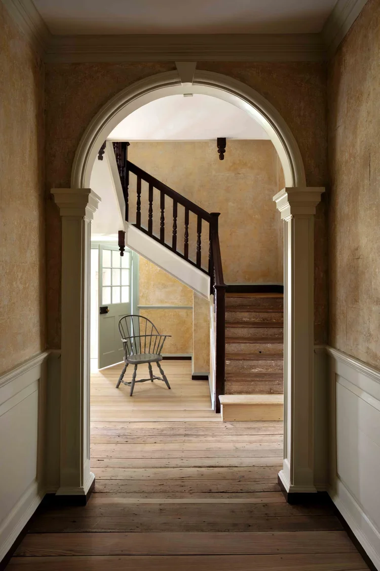 historic-preservation-process-cloverfields-archway-hallway-kimmel-architects.webp