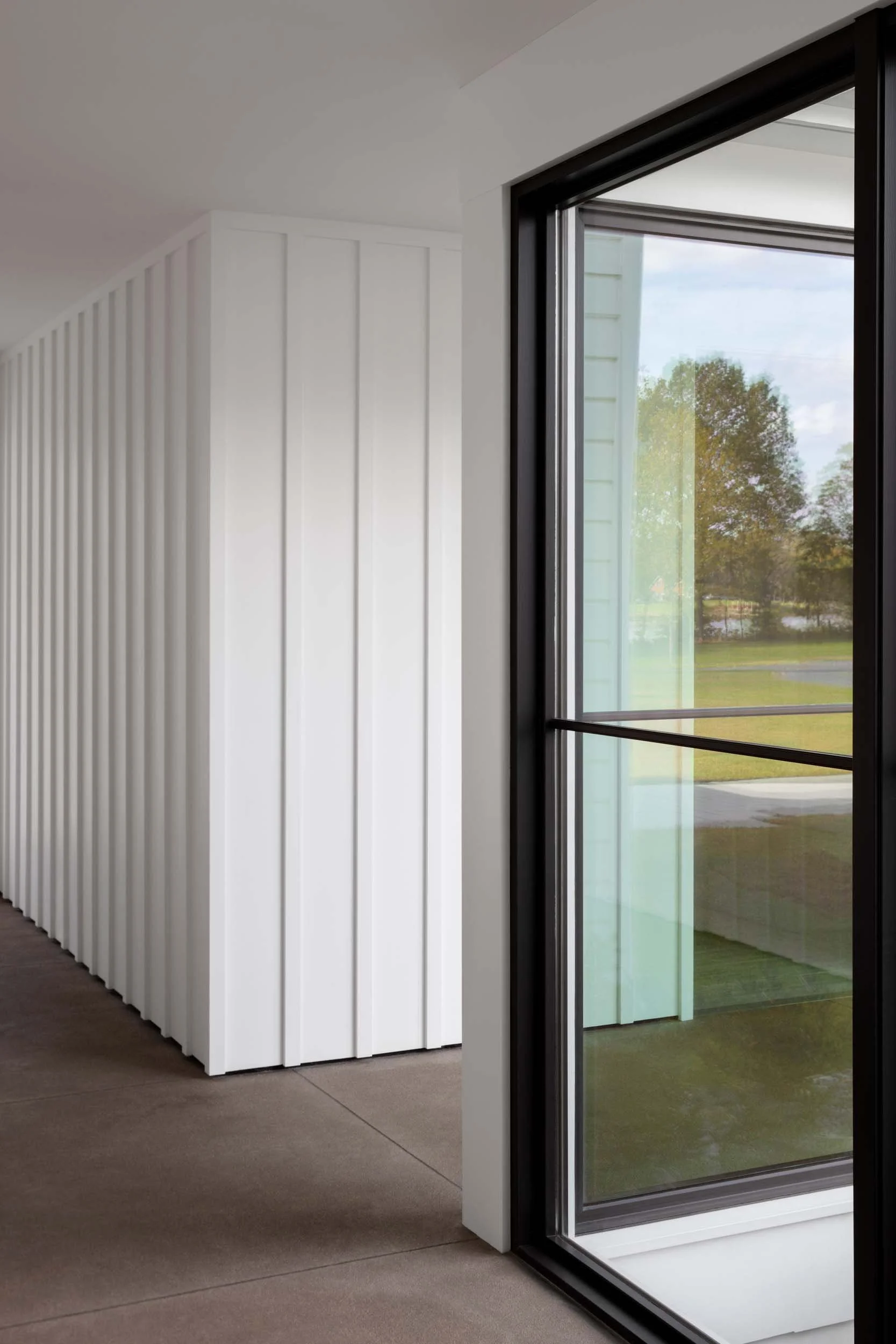 tidewater-farmhouse-chesapeake-wood-paneling-hallway-queenstown-md-kimmel-architects.jpg