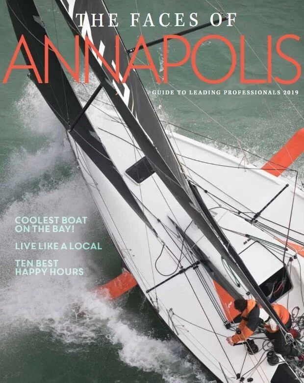 Kimmel Studio Architects The Face of Annapolis A sailing boat on the water with crew members on board, seen from above.