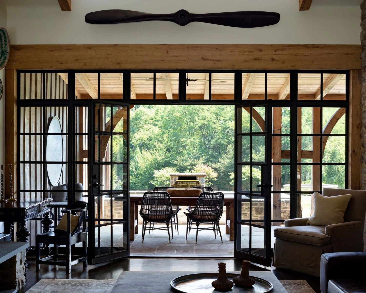 tudor-renovation-stone-dining-room-patio-doors-pikesville-md-kimmel-architects.webp
