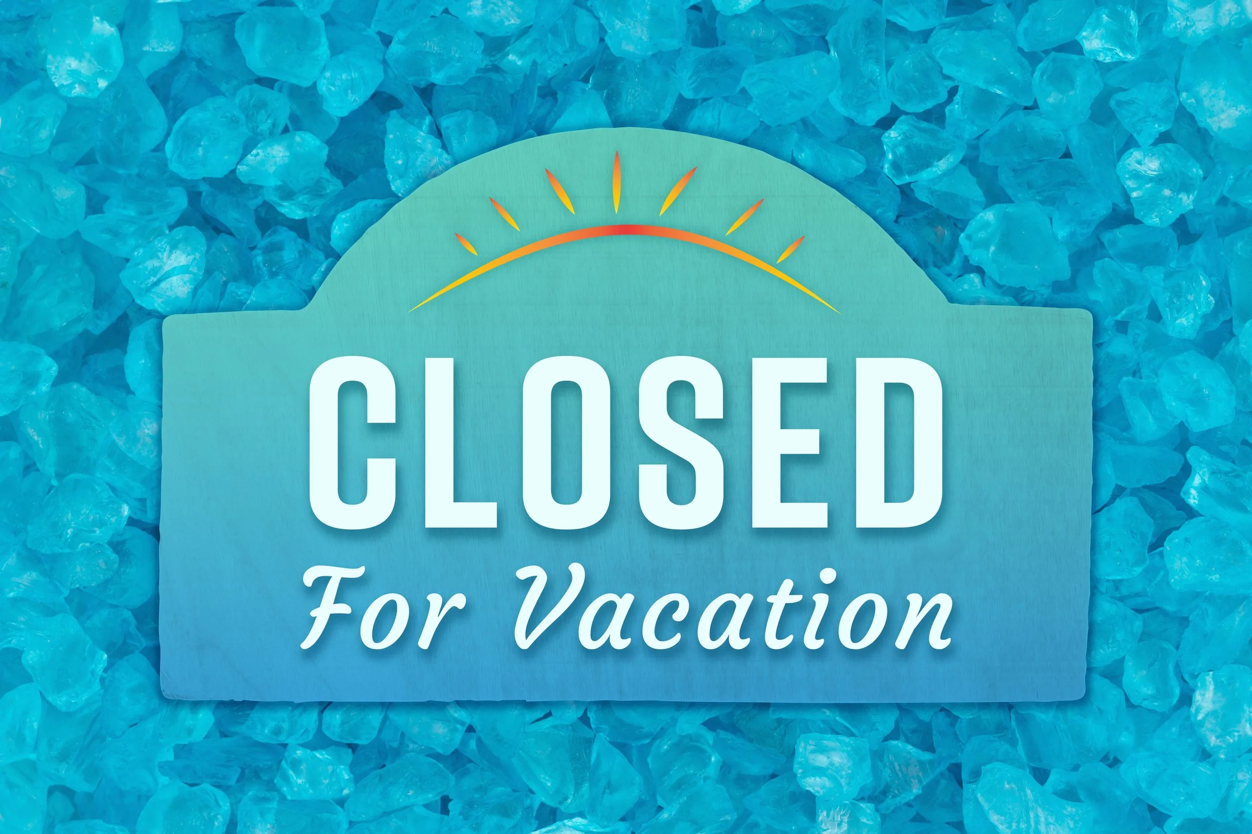 A sign with a blue background and text that reads 'CLOSED For Vacation' on a bed of blue ice.