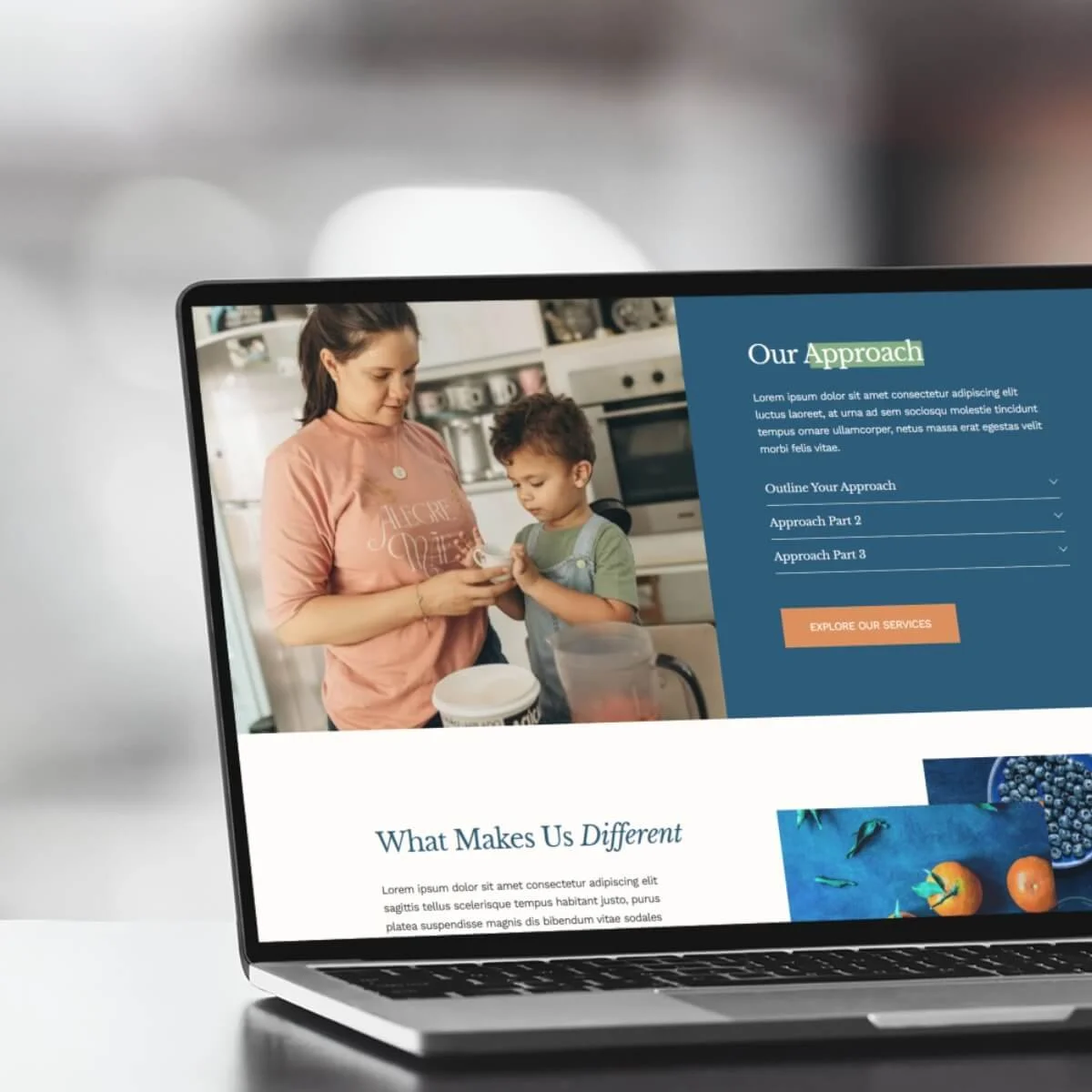Laptop screen showing a webpage with a photo of a woman and a young boy in a kitchen, with text sections titled 'Our Approach' and 'What Makes Us Different'.