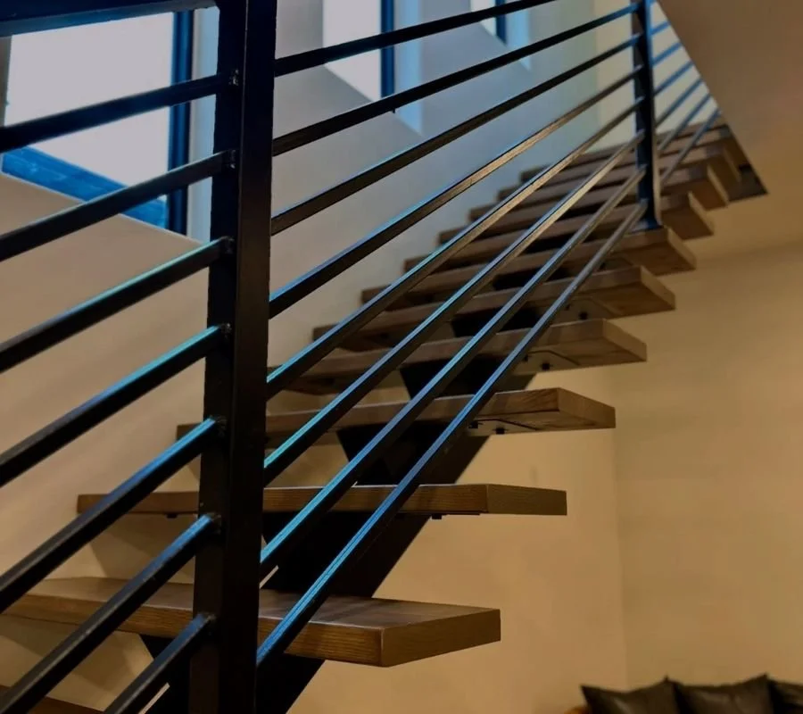 modern floating staircase black metal railing