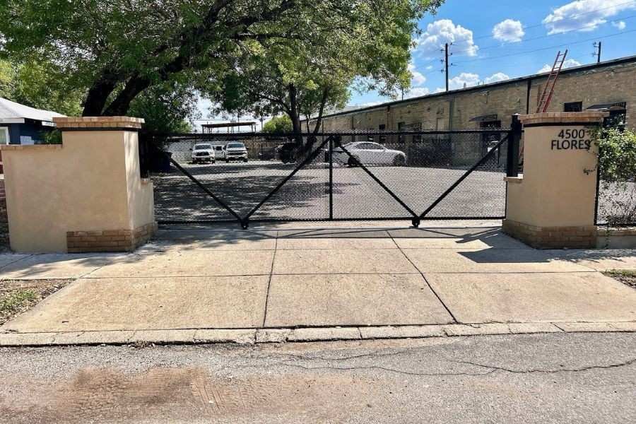 Custom double steel driveway gate with privacy panels