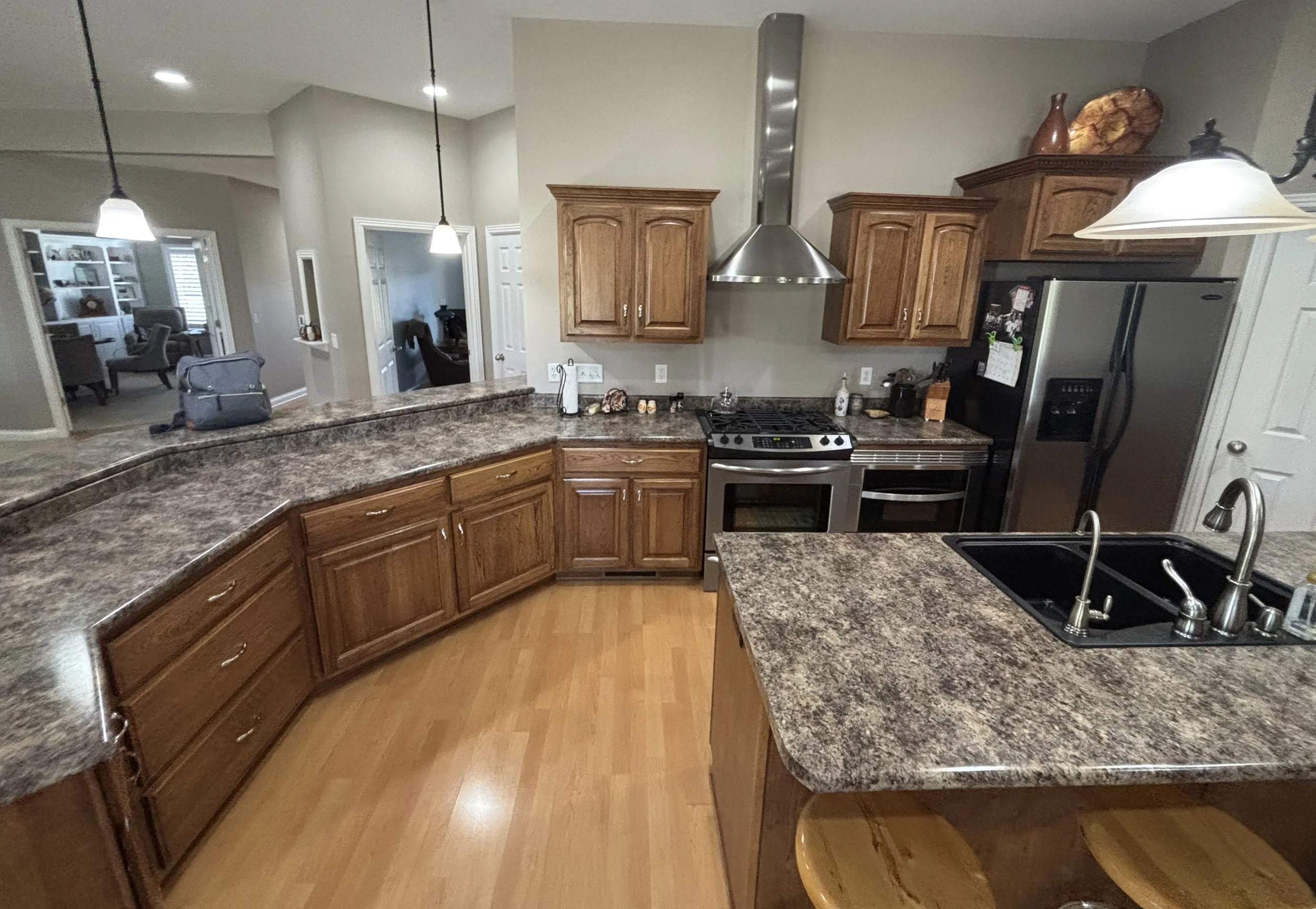 Updated kitchen with new floors, countertops, & marble herringbone backsplash