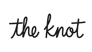 The knot logo with the words 'the knot' written in black cursive font.