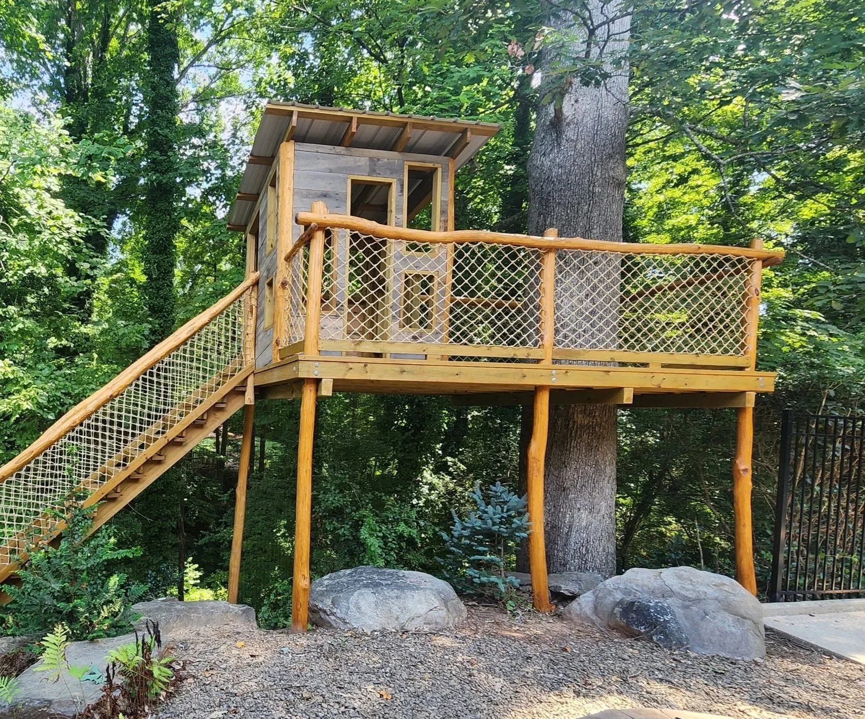 Hillside treehouse with adventure stairs in downtown Morganton, North Carolina.