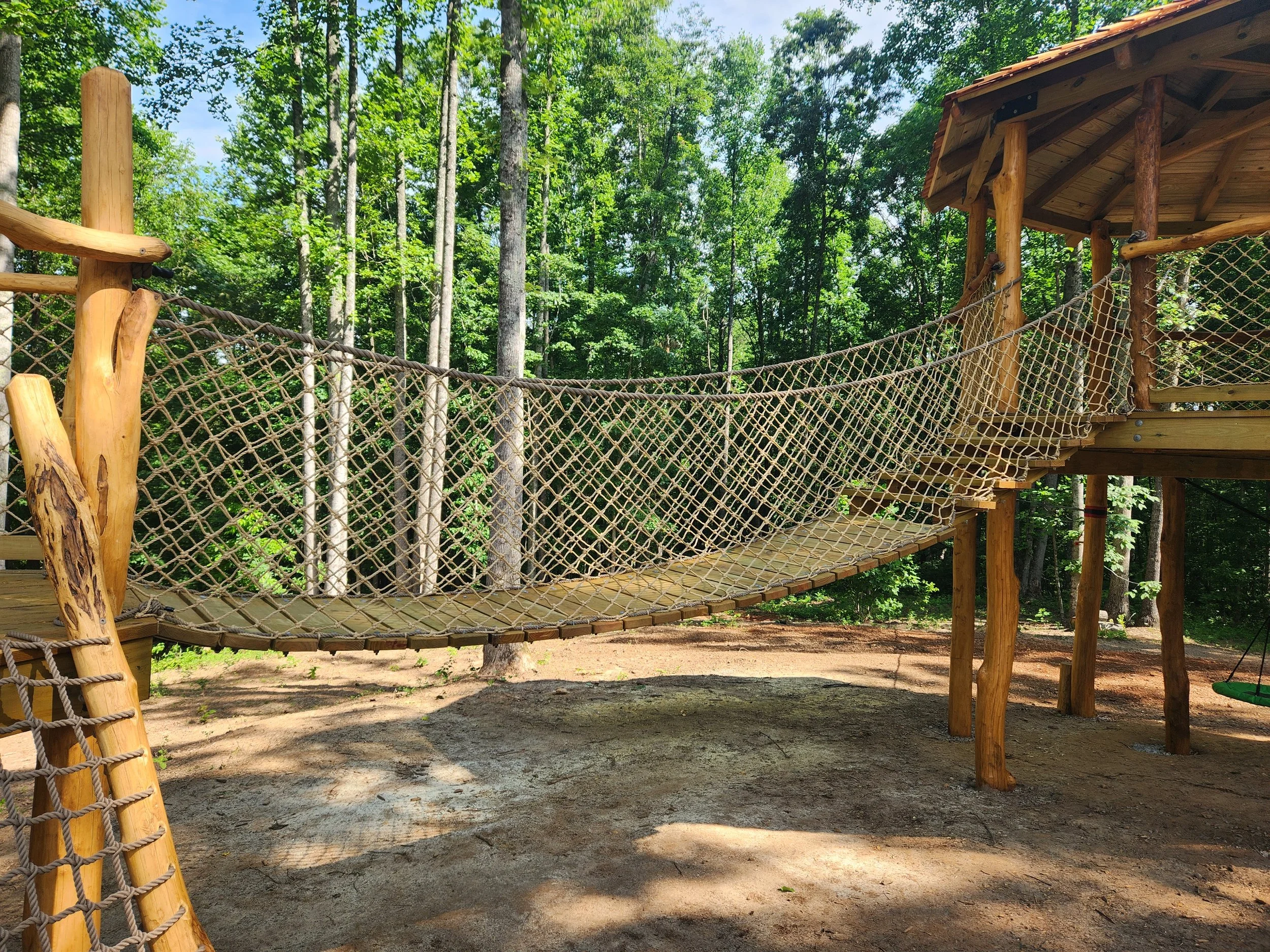 talking-rock-ga-custom-black-locust-playground-treehouse-suspension-bridge-000.jpeg