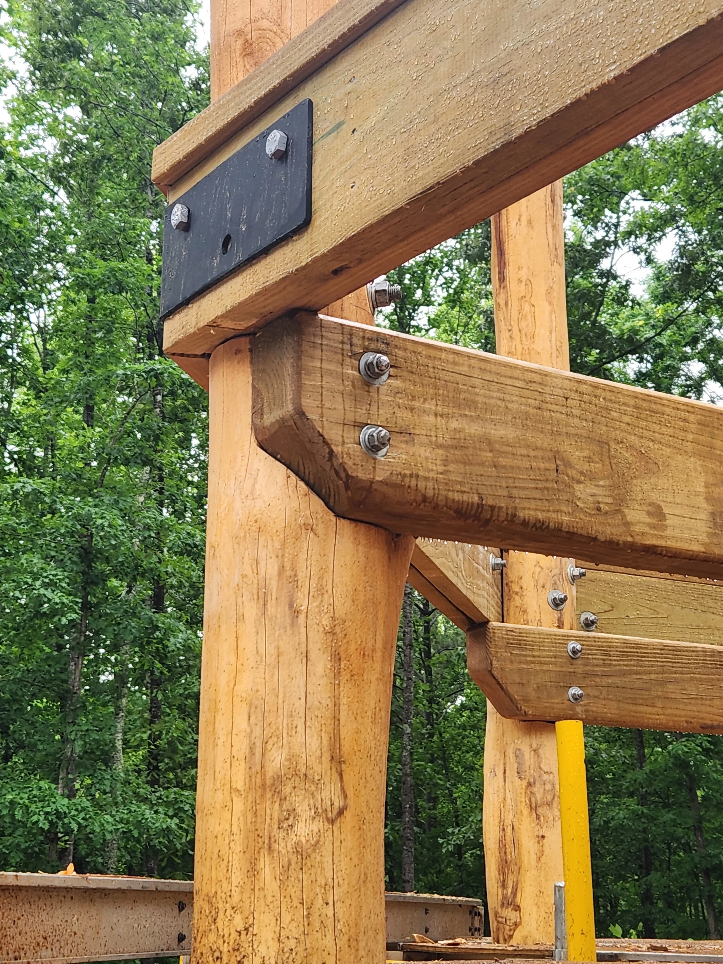 talking-rock-ga-custom-black-locust-playground-treehouse-beam-installation-002.jpeg