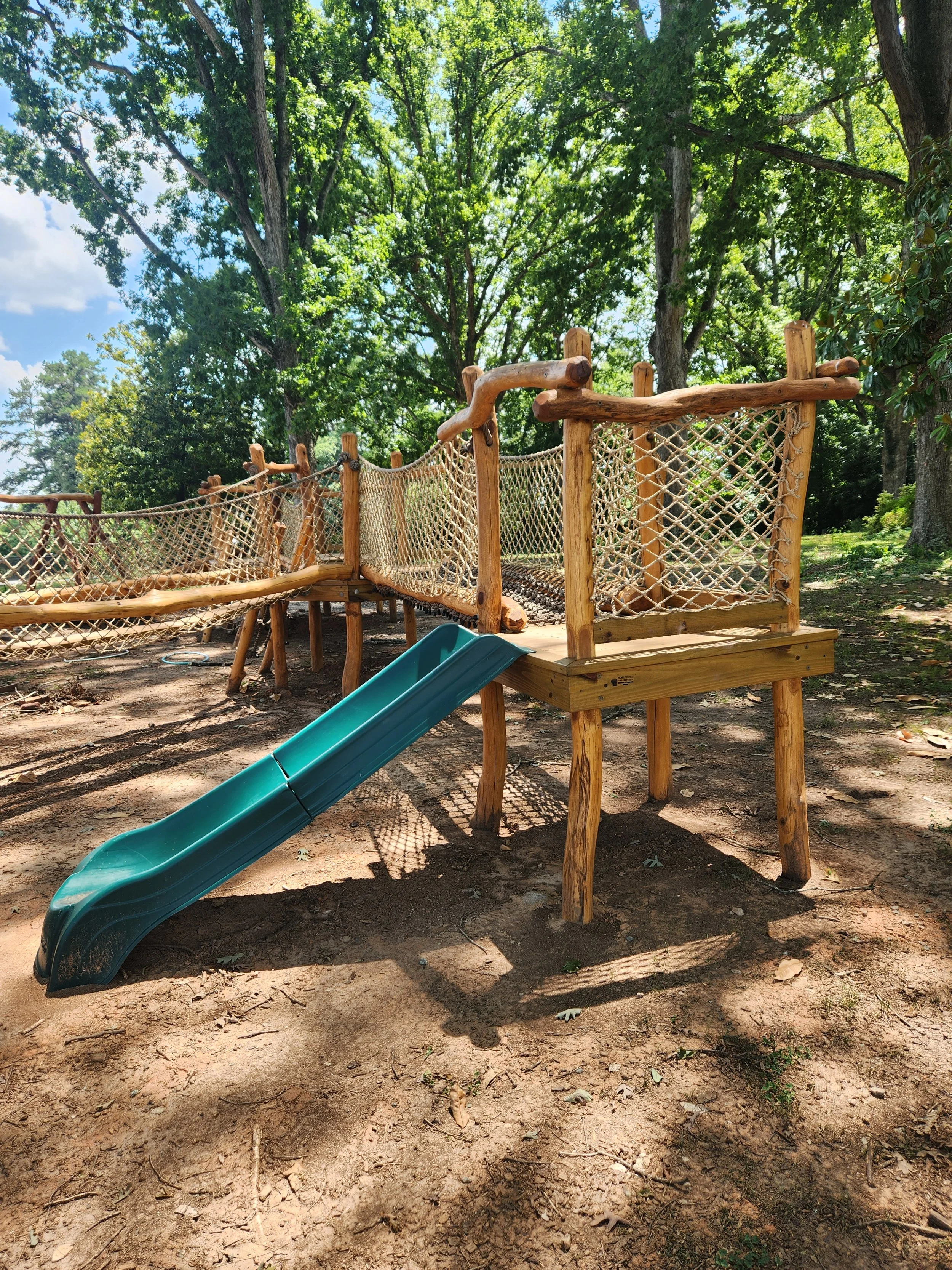 davidson-nc-custom-black-locust-playground-treehouse-slide-000.jpeg