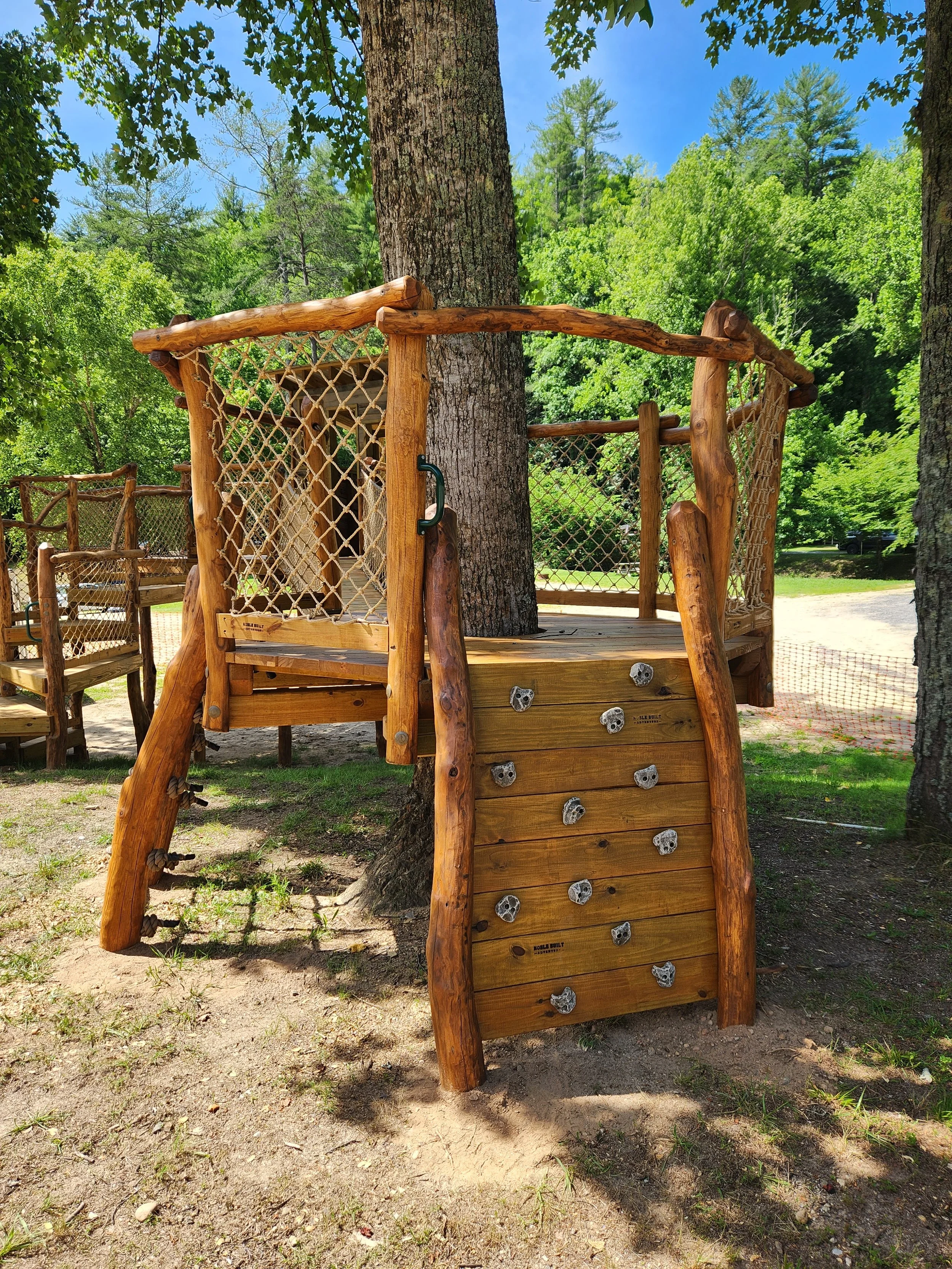 morganton-nc-horseshoe-bend-family-campground-custom-black-locust-playground-treehouse-climbing-wall-000.jpg