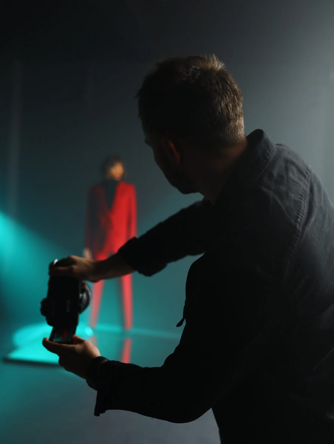 Portrait photography session featuring model in striking red outfit