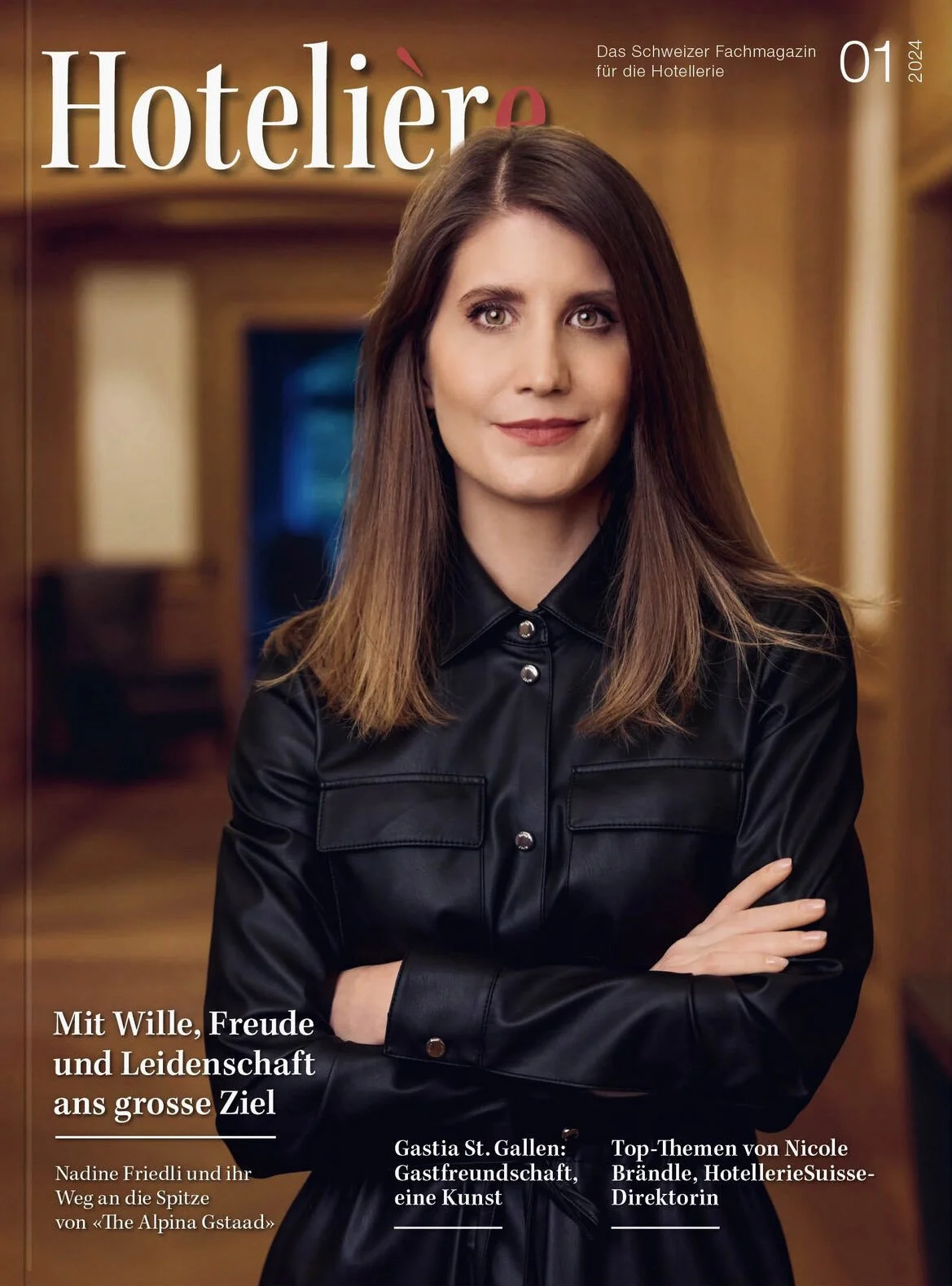 Woman_in_black_leather_shirt_with_arms_crossed_indoors.jpg