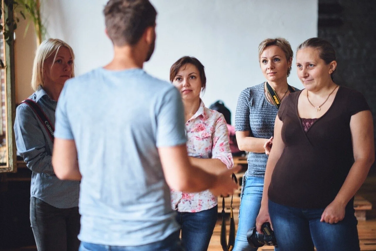 Group_of_Women_Engaged_in_Photography_Discussion.jpg