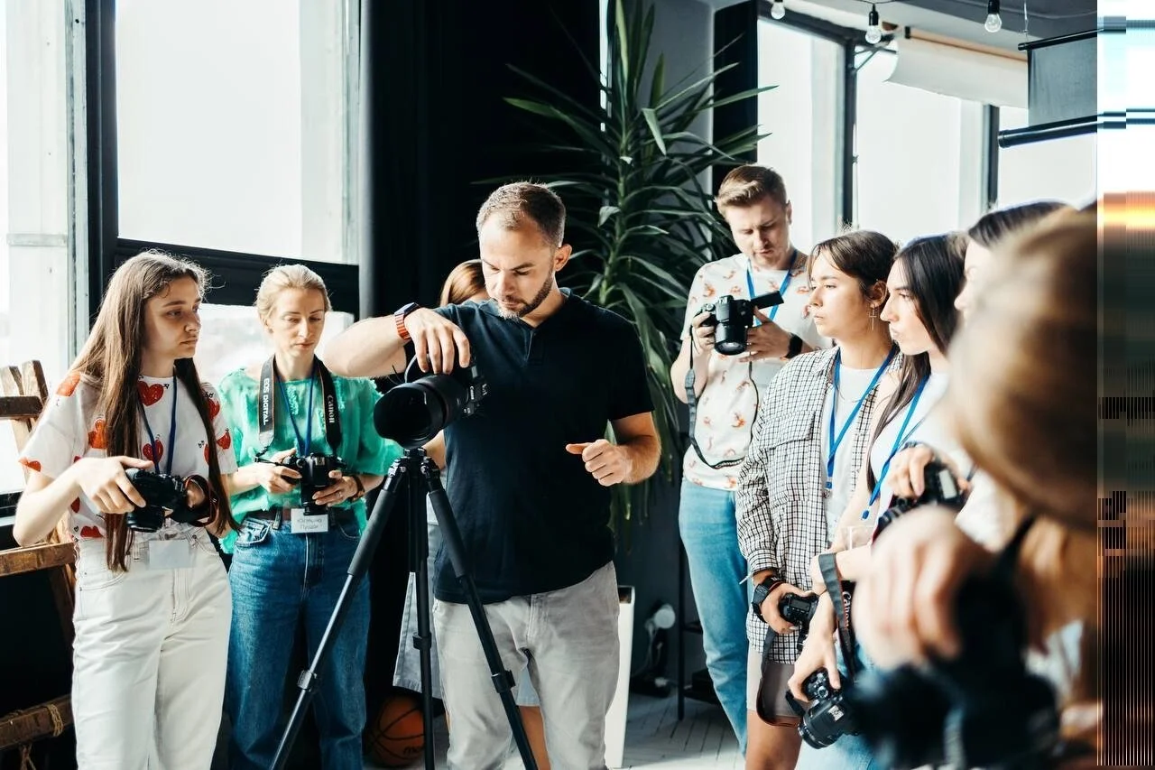 Photography_Workshop_with_Participants_in_Bright_Indoor_Setting.jpeg