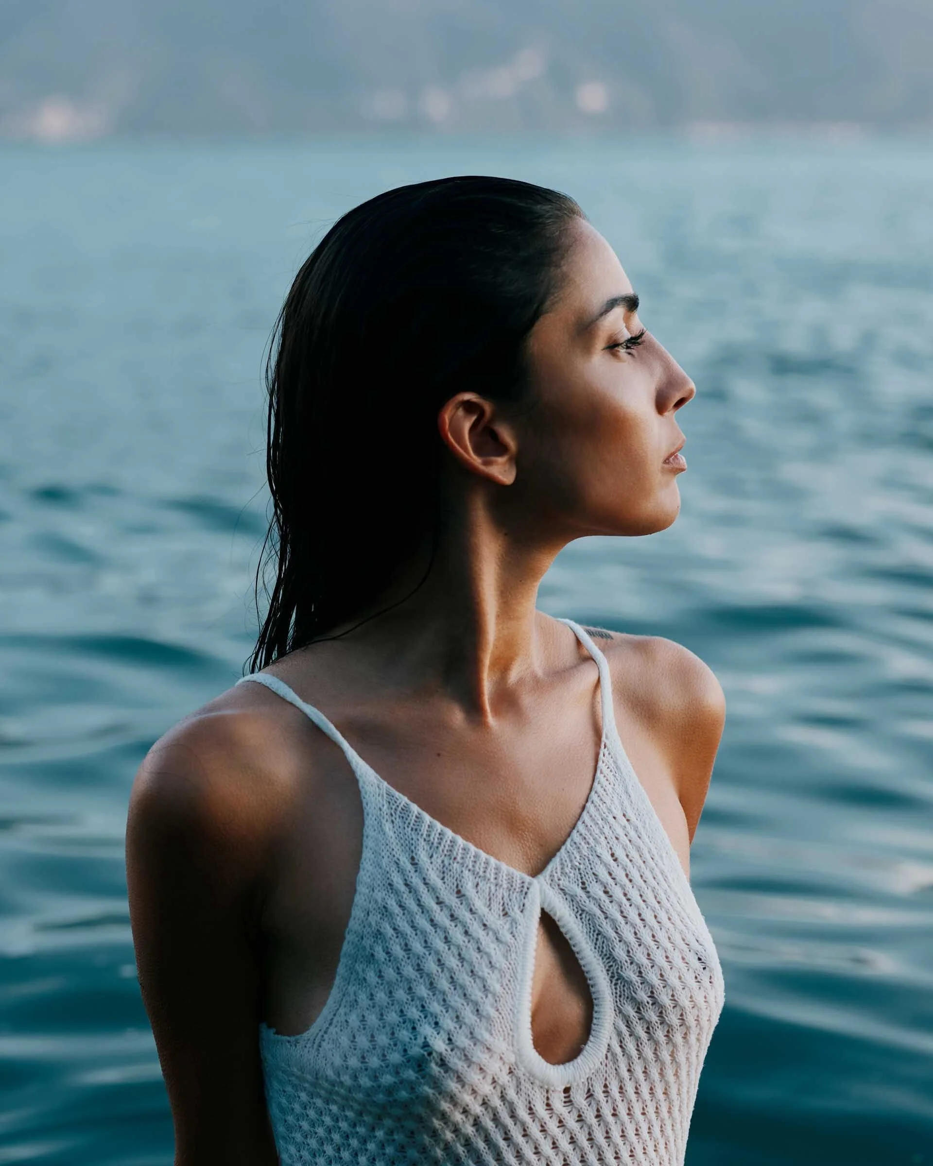Woman_in_White_Swimwear_by_Water.jpg