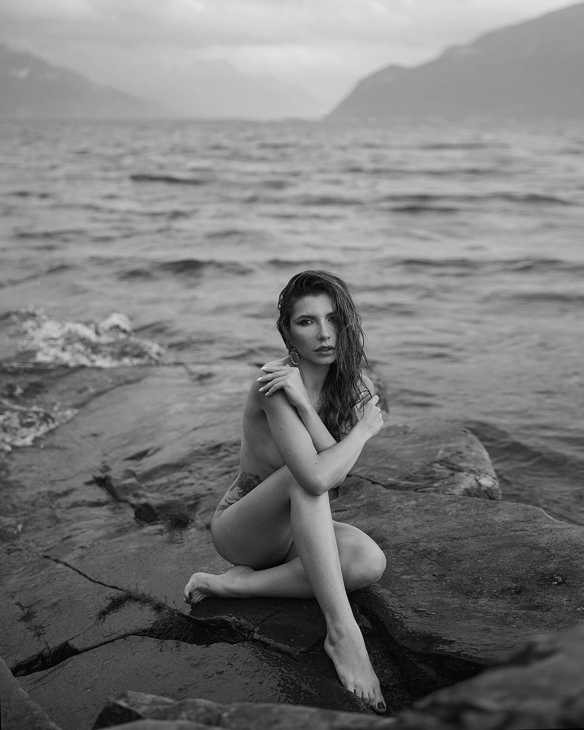 boudoir-seated-rocks-waterfront-black-and-white.jpg