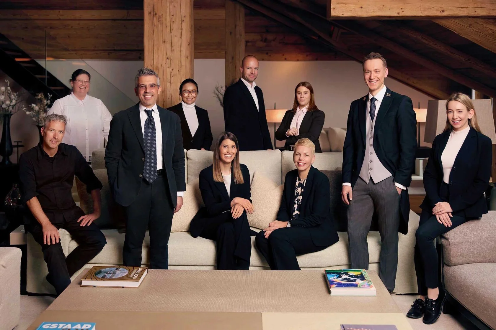 The Alpina Gstaad — team portrait captured in the elegant hotel surroundings.