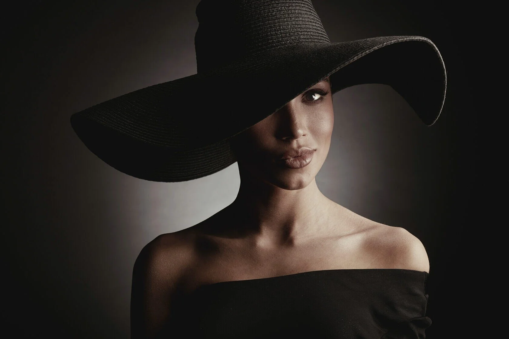 Woman_in_Black_Off-Shoulder_Top_and_Wide-Brim_Hat.jpg