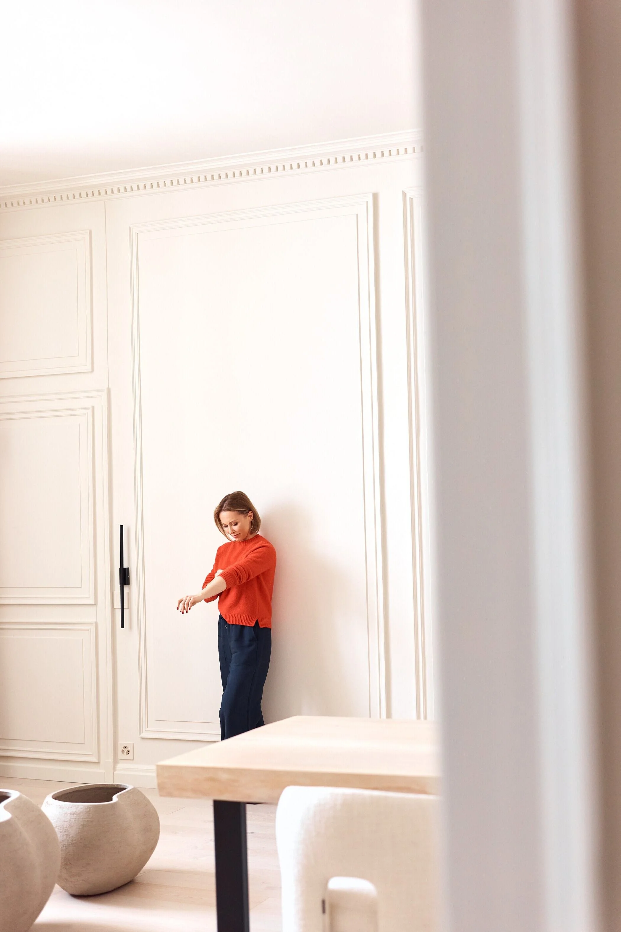 Woman_in_Red_Sweater_Posing_in_Minimalist_Interior.jpg