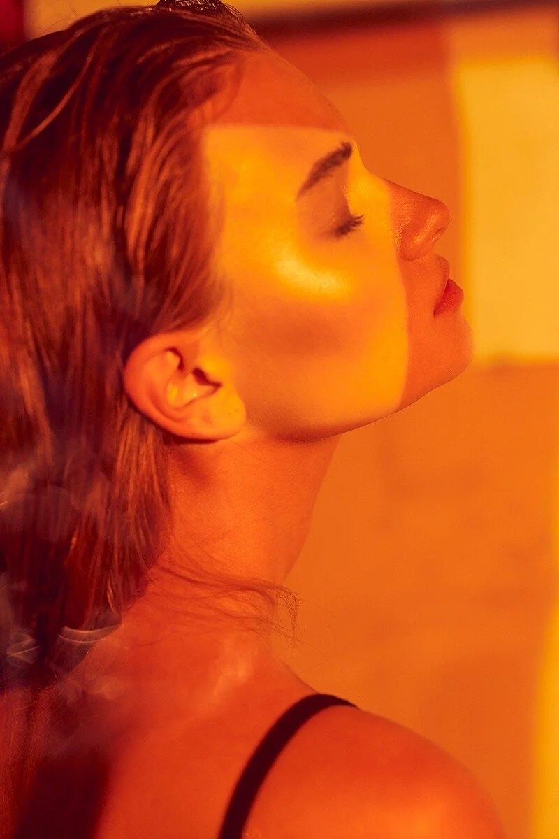 Profile_of_a_woman_with_glowing_skin_in_warm_lighting.jpg