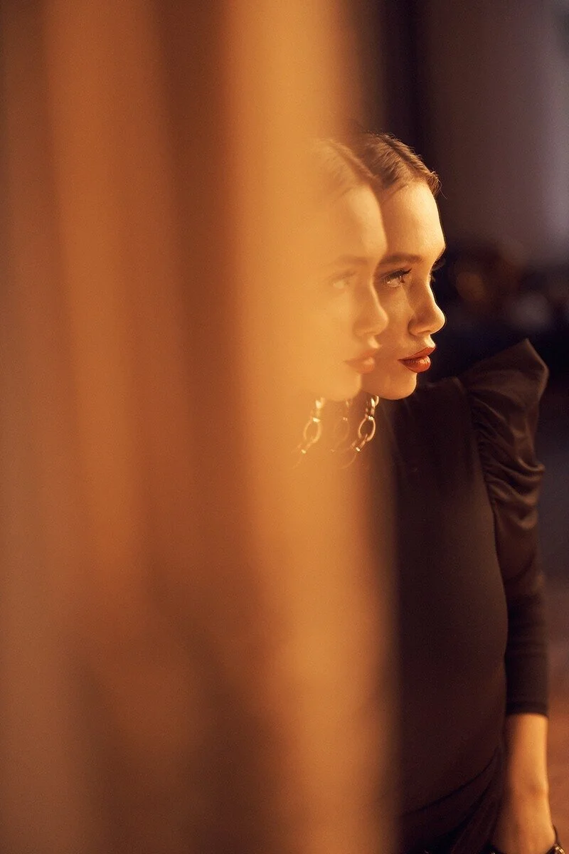 Woman_in_Black_Top_with_Side_Profile_Reflection.jpg