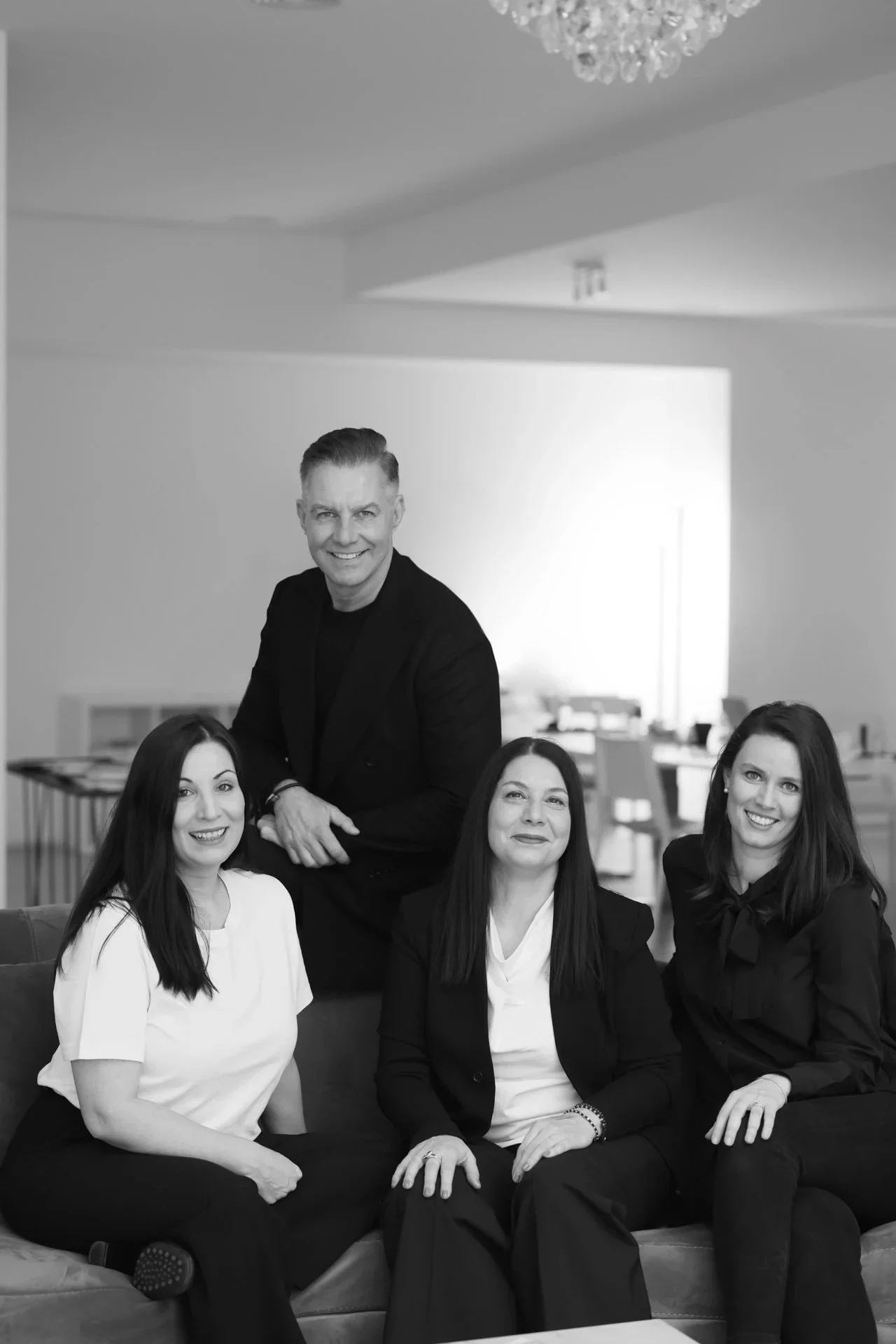 Group_portrait_of_four_individuals_in_a_modern_setting.jpg