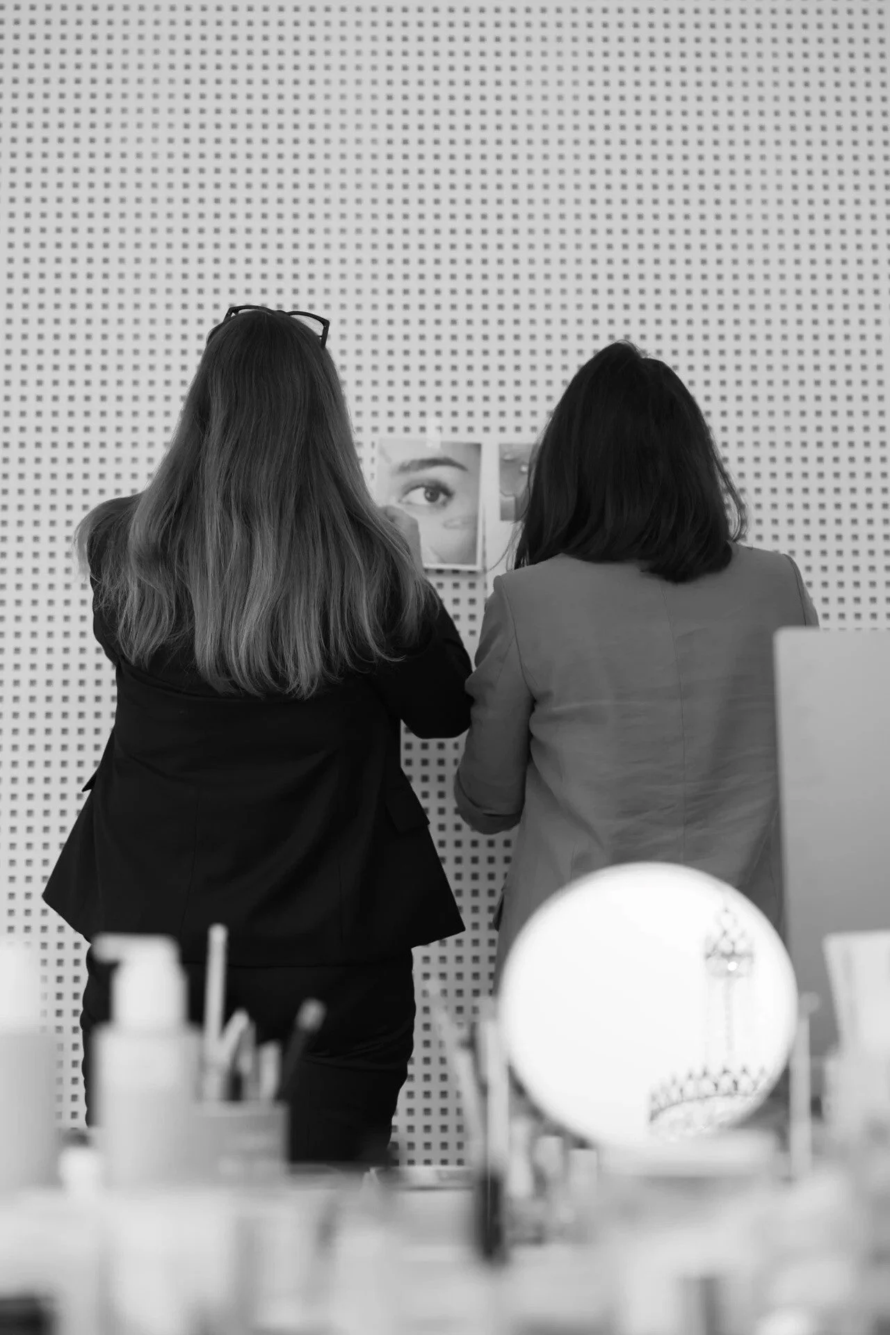 Two_women_examining_beauty_images_in_a_studio_setting.jpg