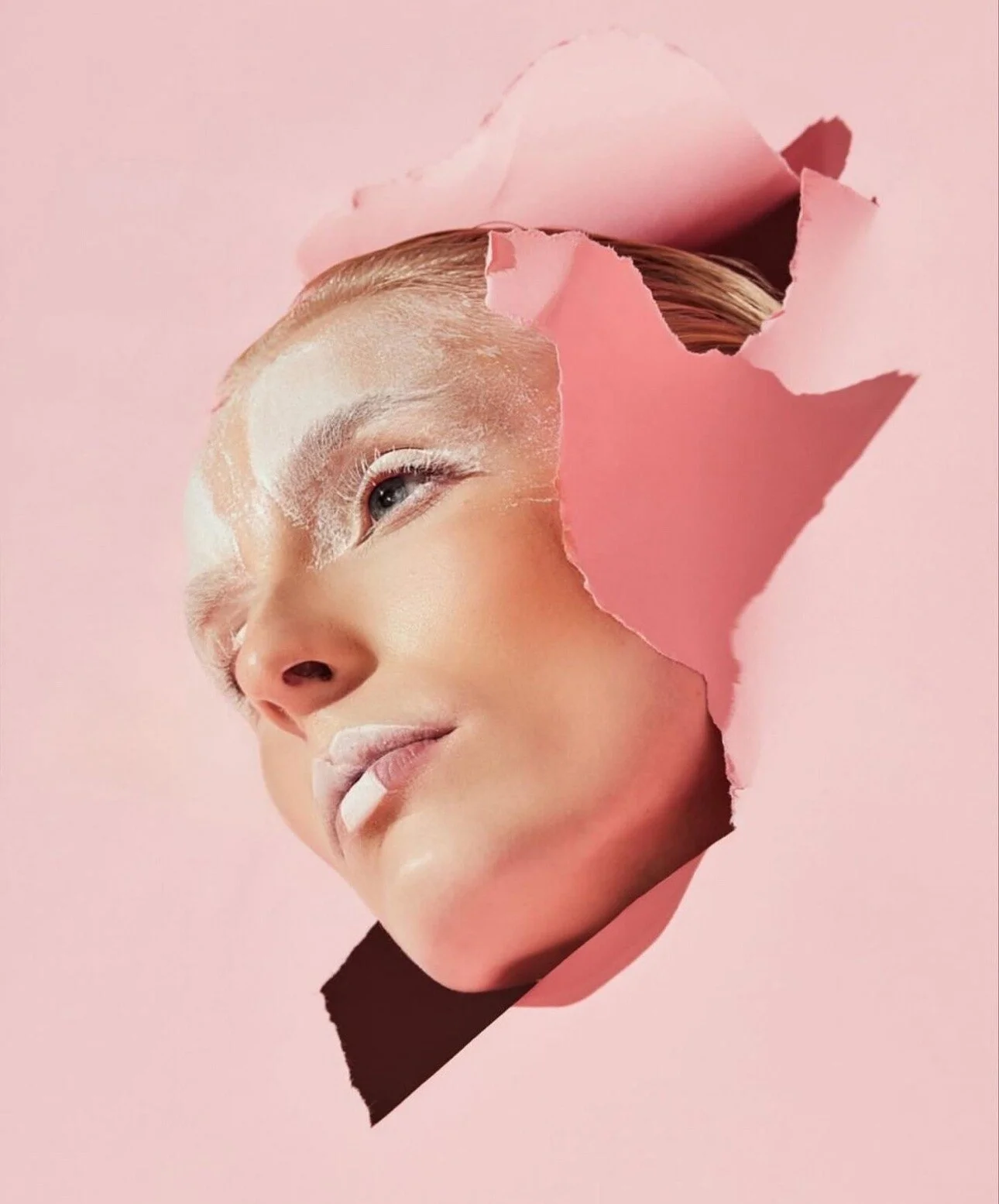 Portrait_of_a_woman_with_pink_background_and_torn_paper.jpg