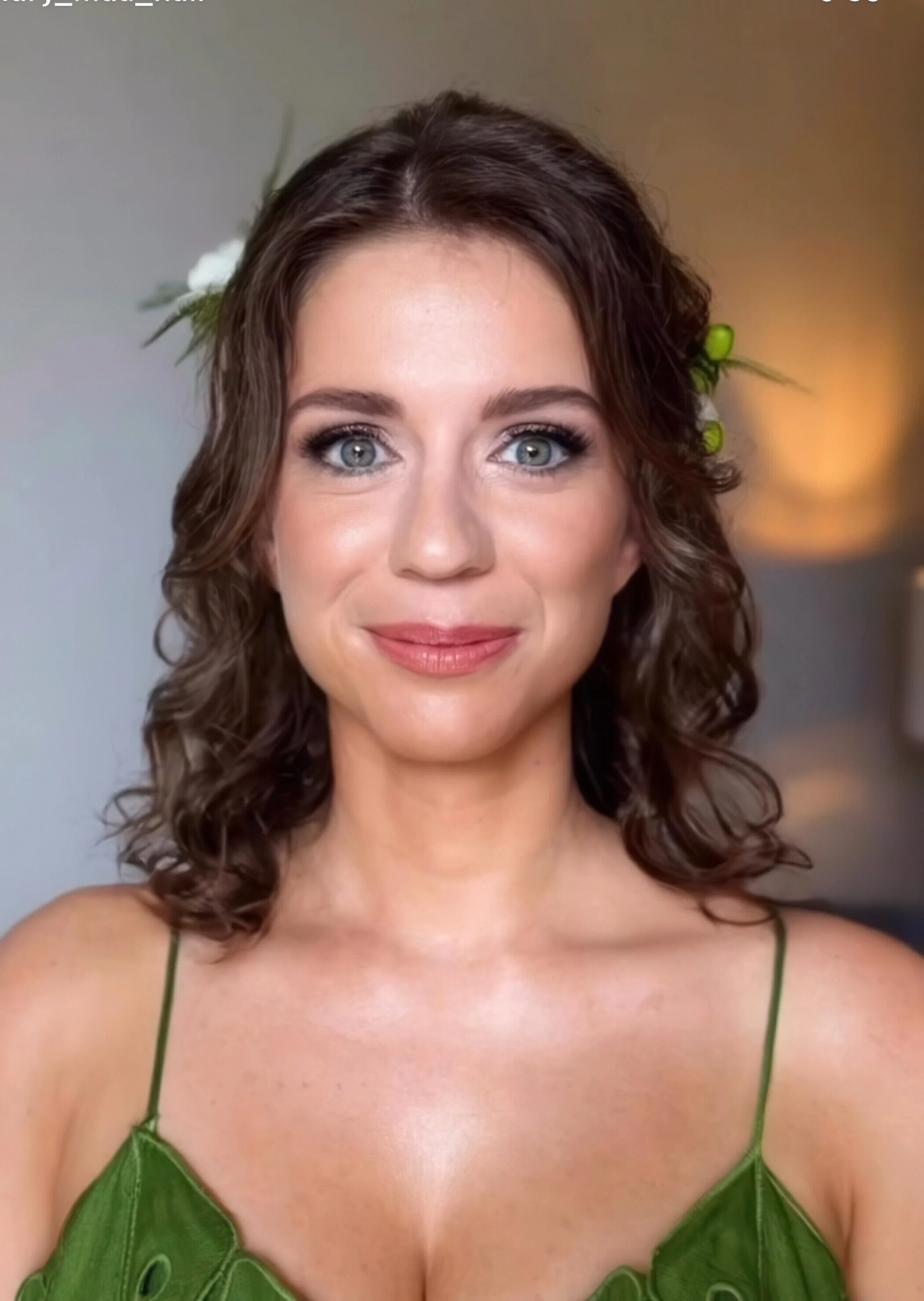 Woman_in_Green_Dress_with_Floral_Accents.jpeg
