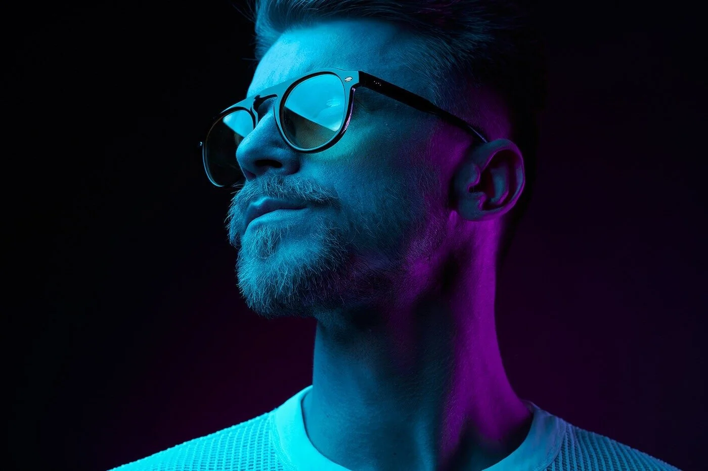 Man_in_sunglasses_with_blue_and_purple_lighting_1.jpg