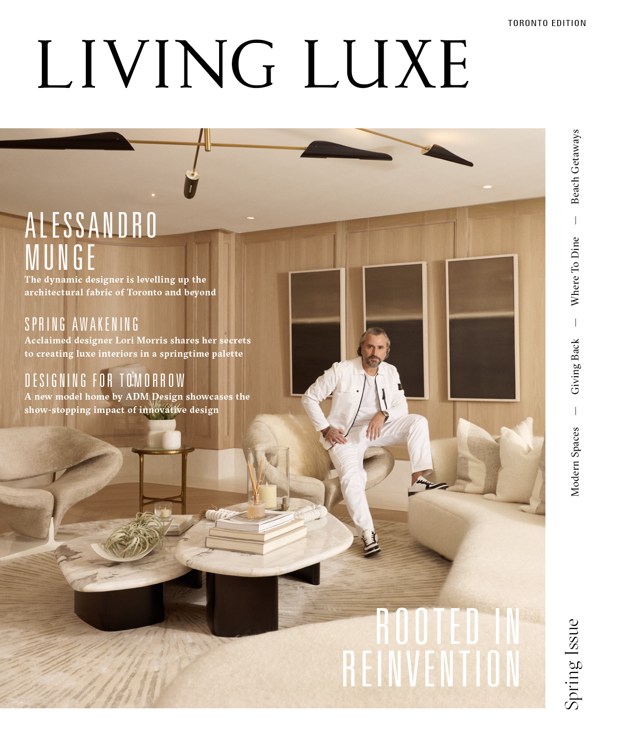 A magazine cover titled 'Living Luxe' featuring a man in a white outfit sitting on a beige sofa in a modern, minimally decorated living room with wooden wall panels and three framed mirrors. The cover includes headlines about architecture, interior design, and innovative homes, and a vertical sidebar listing topics like 'Beach Getaways,' 'Where To Dine,' 'Giving Back,' and 'Modern Spaces.'