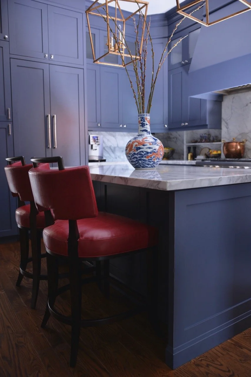 blue-kitchen-cabinets-marble-counter-top-and-red-dining-chairs-beautiful-kitchens.jpg