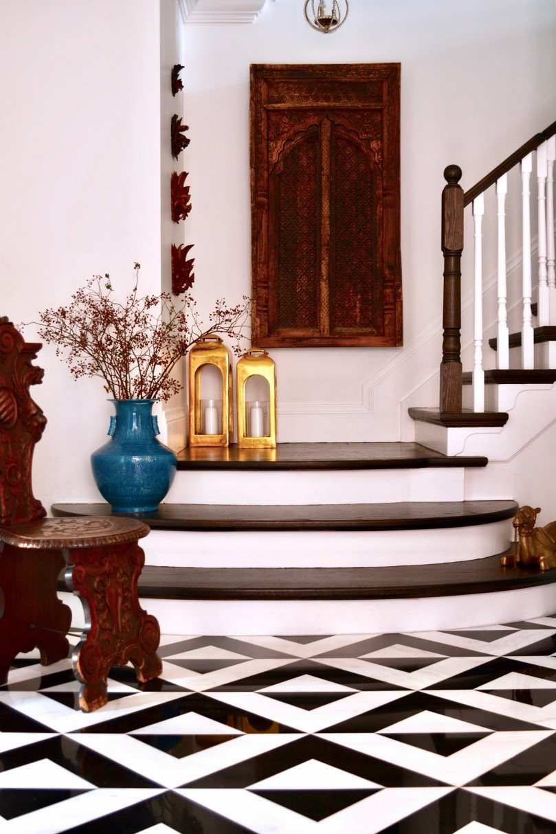 small-spaces-staircase-hallway-with-black-and-white-floor-decor-and-white-and-brown-staircase.jpg