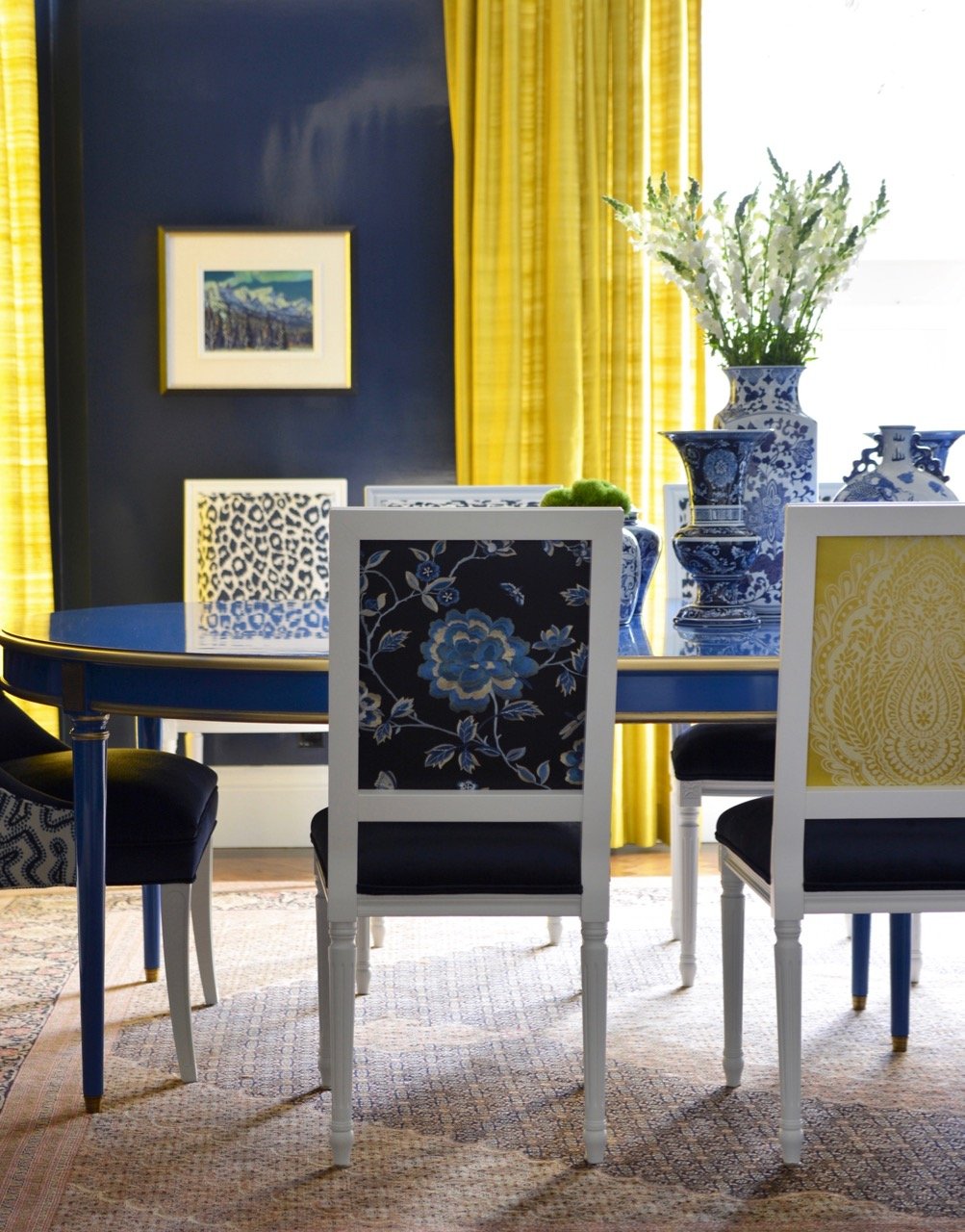 luxury-dining-room-blue-wall-painting-blue-dining-table-and-blue-and-yellow-dining-chairs.jpg