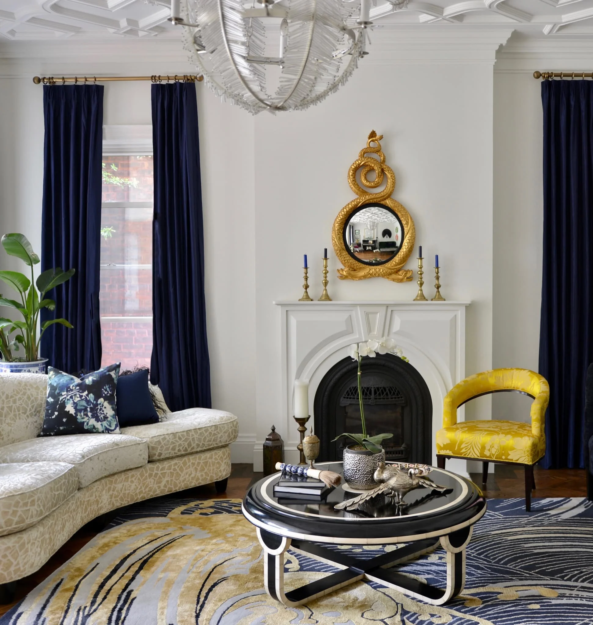 custom-blue-and-yellow-carpet-ceiling-crown-moulding-and-baseboard-trim-in-cozy-living-room-in-luxury-home.jpg